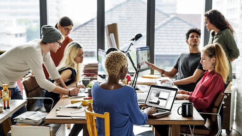 People working seated around a table